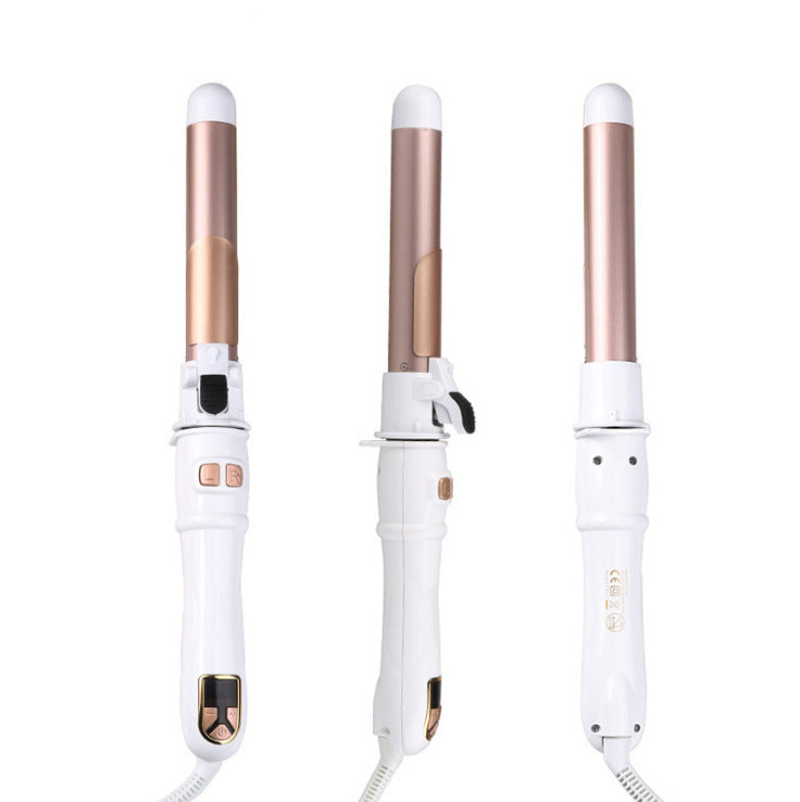 Three white and rose gold hair curlers on a white background