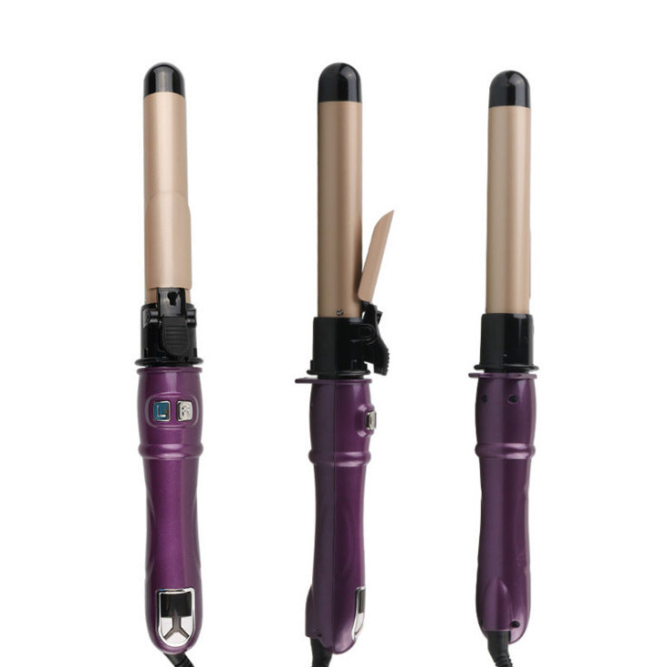 Three purple hair curling irons with black ends on a white background
