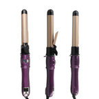 Three purple hair curling irons with black ends on a white background