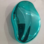 Shiny teal Crystal Hair Eraser on a white background