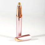 Rose gold Electric Eyebrow Trimmer with gold cap on a white background
