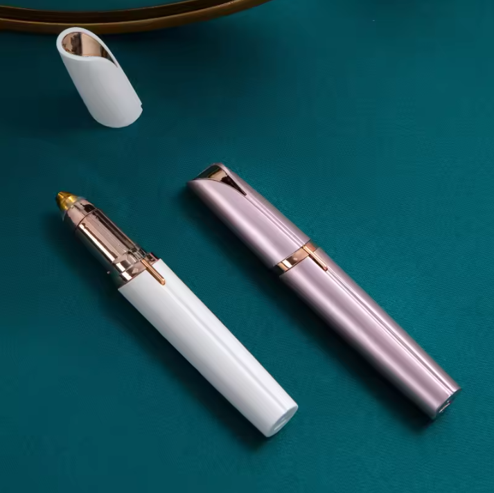 Electric Eyebrow Trimmer with white and rose gold accents on a teal background